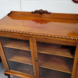Chippendale style Mahogany two door bookcase. It has bevelled glass doors and two adjustable shelves. It has been sourced locally and is in good original detailed condition.