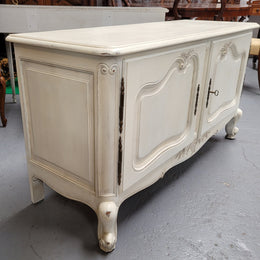 Louis XV style chalk painted two door cabinet which would also make an ideal TV cabinet. It has been sourced from France and in good original detailed condition.