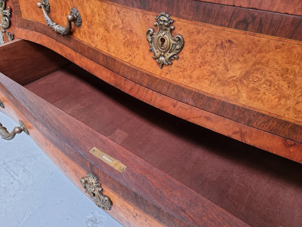 A beautiful French Louis XIV style walnut and burr walnut commode of grand proportions. It has three large drawers and elaborate bronze mounts with a fabulous marble top. In very good original detailed condition.