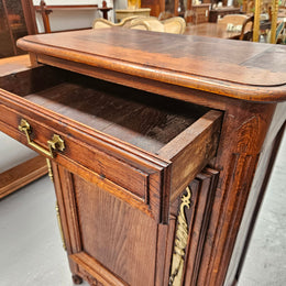 Louis 15th style oak 19th century cabinet with lovely brass hinges, handles & charming carving.  Circ: 1860's. In good original condition.