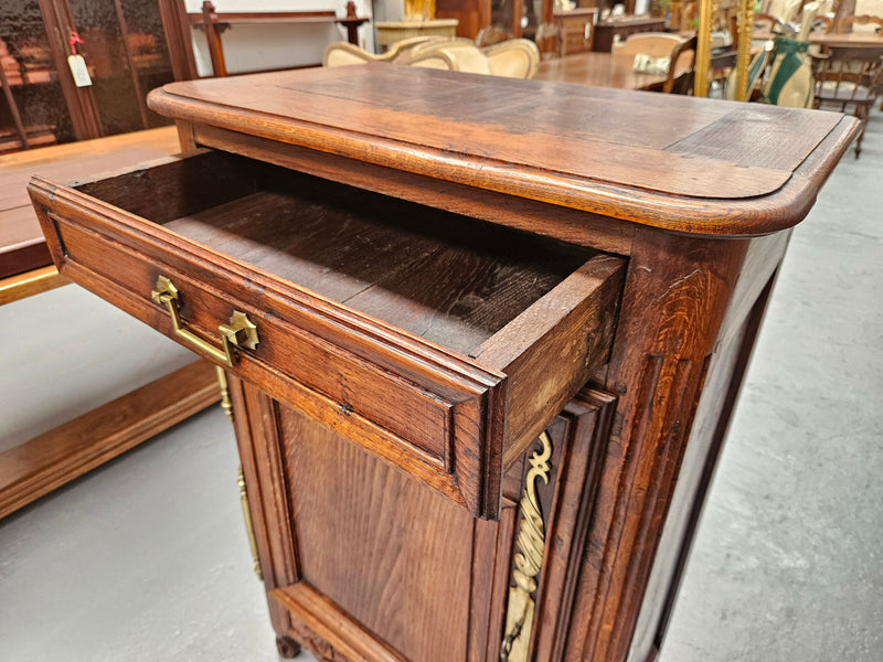 Louis 15th style oak 19th century cabinet with lovely brass hinges, handles & charming carving.  Circ: 1860's. In good original condition.