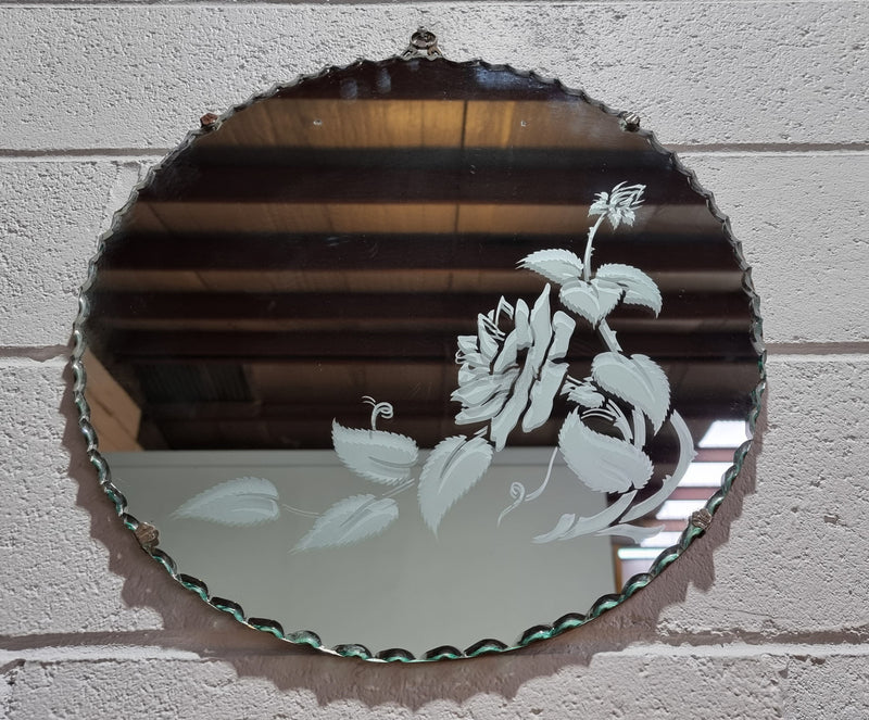 Vintage Art Deco round wall mirror with pie crust edge and etched floral design . In good condition, please see photos .