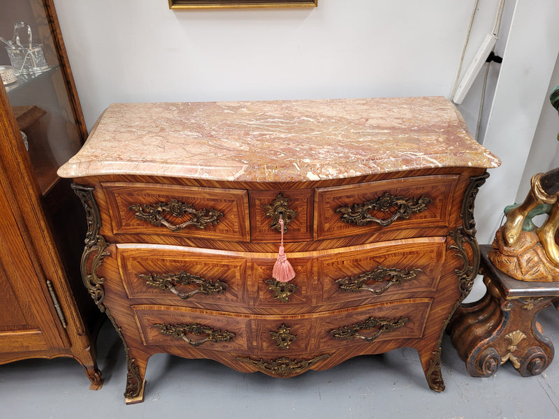 Beautiful French Louis XV style Kingwood inlaid marble top four drawer commode. It has decorative mounts and has been sourced from France. It is in good original detailed condition.