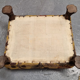 Lovely Upholstered Georgian footstool with feet. It has been sourced locally and is in good original condition.