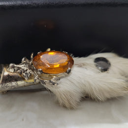 Scottish Grouse foot with Amber coloured glass. In good original condition, please view photos as they help form part of the description.