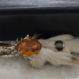 Scottish Grouse foot with Amber coloured glass. In good original condition, please view photos as they help form part of the description.
