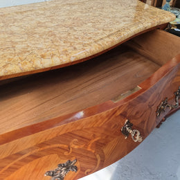 French marquetry inlaid Kingwood marble top commode. It has two drawers and beautiful mounts. Is in good original detailed condition.