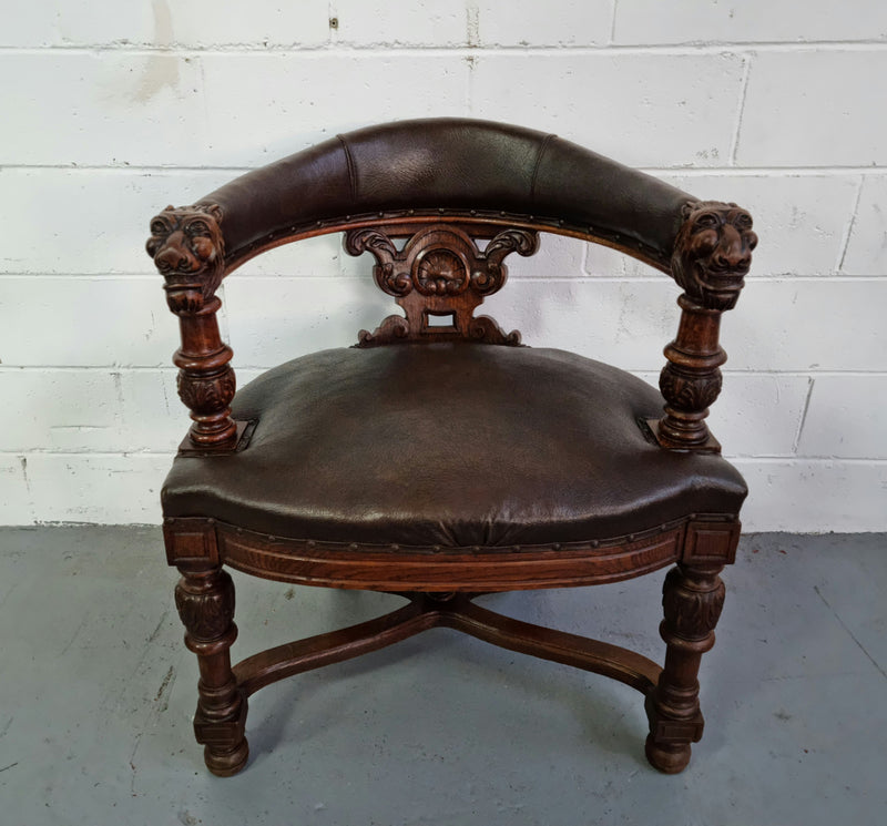 Henry 2nd style French Oak leather library chair with amazing detailed carvings. It is very comfortable to sit in and the leather is in good original condition.