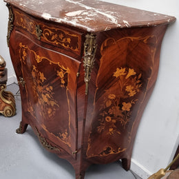 Stunning French Transitional style Mahogany marquetry inlay salon cabinet in the bombe shape. It has one draw, one shelf, marble top & ormolu decoration. Sourced from France and in good original detailed condition.