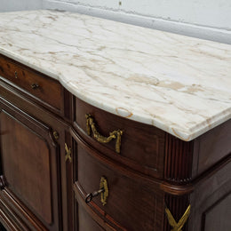 Fabulous French Walnut Louis XVI style cupboard, with a lovely marble top and nine drawers. There is also a cupboard and beautiful ormolu mounts. It is in good original detailed condition.