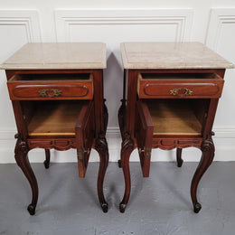 Pair of French Antiloopque Louis XV style Walnut and marble top bedsides. They have lovely carvings along with a drawer and cupboard space. They are in good original detailed condition and have been sourced from France