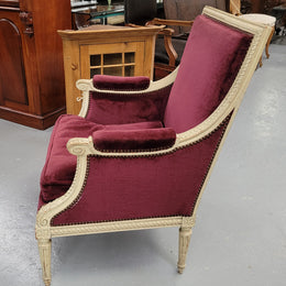 Louis 16th Style high back upholstered chair with maroon velvet fabric, decorative carvings and original paint. It has been sourced from France and in good original condition.
