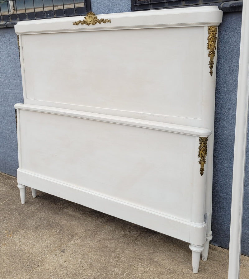 French Louis 16th style chalk painted queen size bed with gilt decorative mounts and includes custom slats. It has been sourced from France and in good original condition.