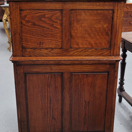 Charming petite English Oak fitted roll top desk. It has a very lovely fitted interior and a drawer at the front ideal for a unit or apartment. Sourced locally and in good original detailed condition.