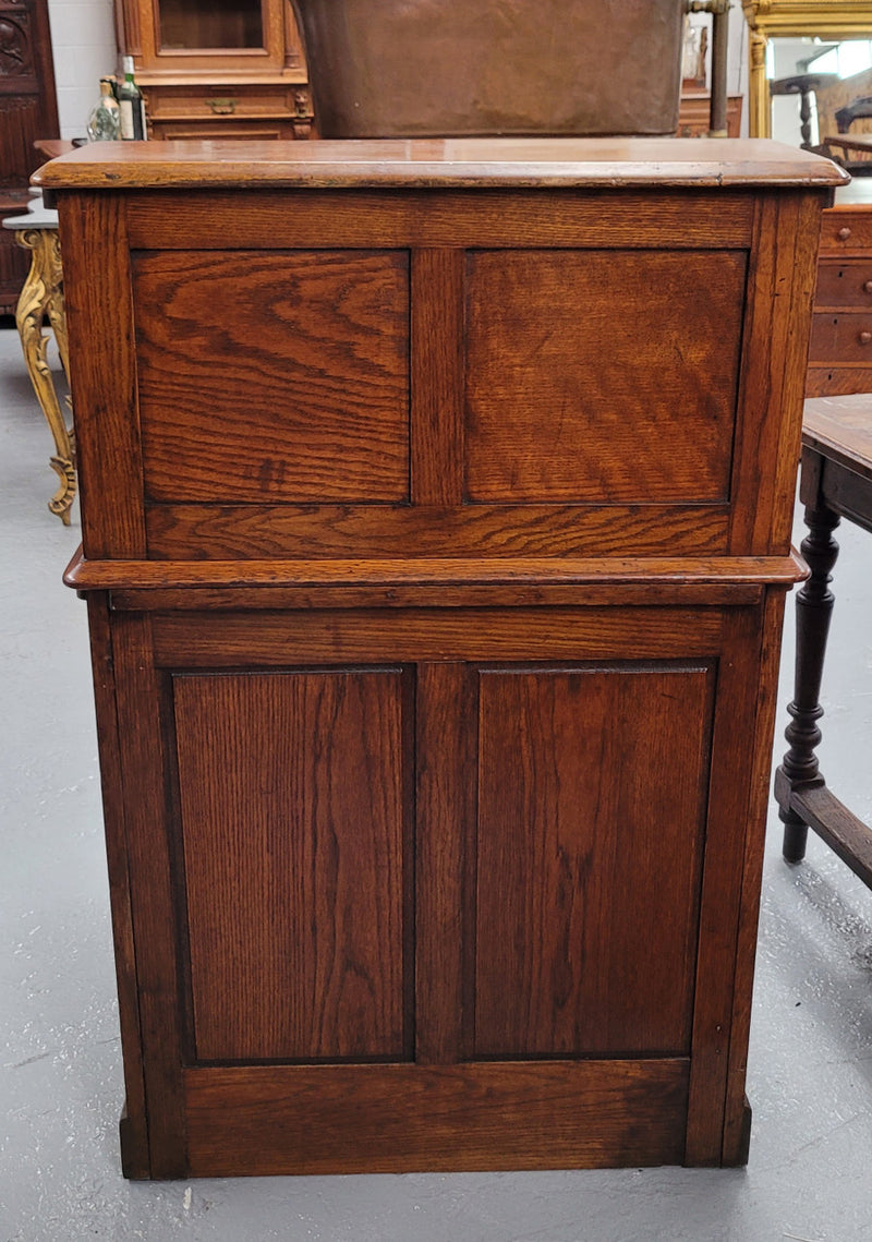 Charming petite English Oak fitted roll top desk. It has a very lovely fitted interior and a drawer at the front ideal for a unit or apartment. Sourced locally and in good original detailed condition.