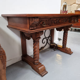 Amazing French Oak Spanish style console table with three drawers and decorative carvings. This piece is in great original condition and has been sourced from France. Circa 1930's.