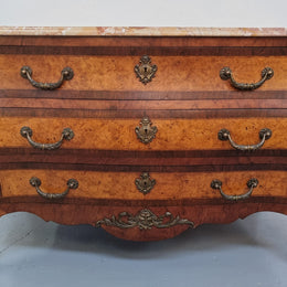 A beautiful French Louis XIV th style walnut and burr walnut commode of grand proportions . It has three large drawers and elaborate bronze mounts with a fabulous marble top . In very good original detailed condition.