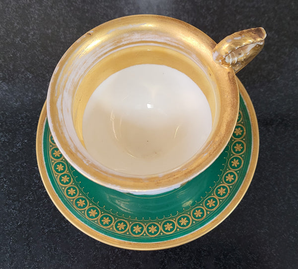 “Old Paris Porcelain” large cup and saucer with hand painted river landscape featuring castles. Gilt and enamel decoration. Circa: early 19th Century. In good original condition please view photos as they help form part of description.