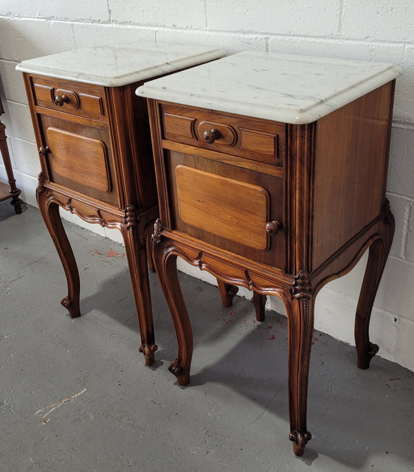 Pair of stunning Louis XV style French Walnut white marble top bedside cabinets. They have one drawer and a cupboard that is marble lined. The marble has been polished and they are in good original detailed condition.