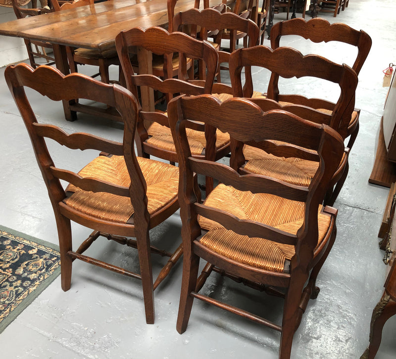 Antique Set of Six French Oak rush seat dining chairs. They are in good original condition and are very strong.
