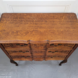 Vintage French dark Oak Louis XV style chest of three drawers. It has beautiful cabriole legs, elegant brass handles and decorative carving throughout. It is in good original detailed condition and has been sourced from France.