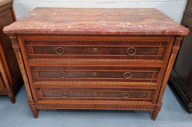 Lovely decorative French walnut and burr Walnut 3 drawer commode with a stunning coloured marble top and lovely carved details. In very good detailed condition.