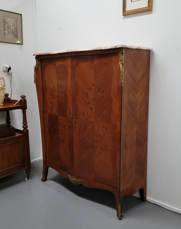 French Louis 15th style Kingwood marquetry inlaid two door cupboard with a beautiful marble top. It has three adjustable shelves and decorative ormolu trim. It has been sourced from France and is in good original detailed condition.
