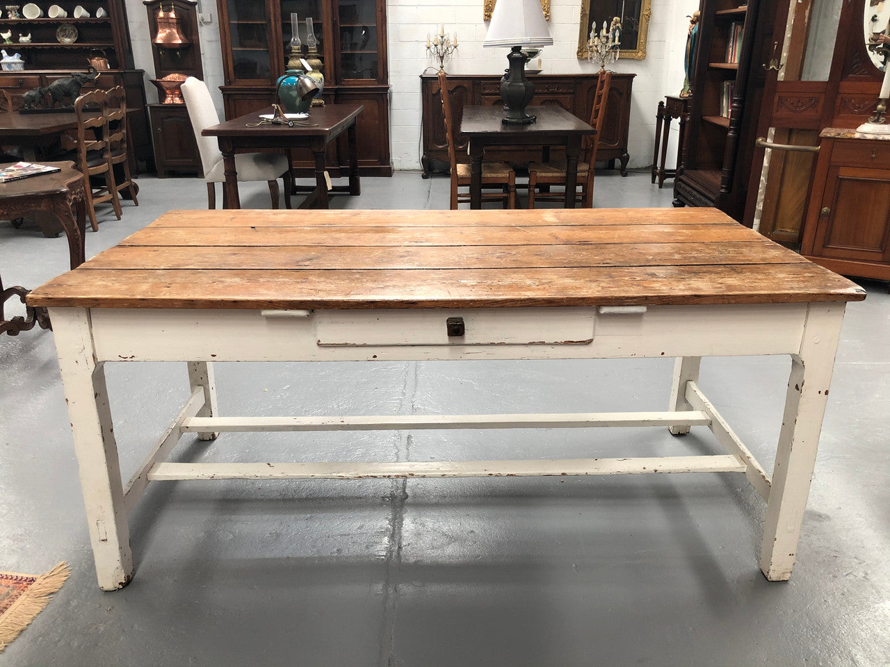 Early Victorian Pine table/desk with drawer on one side and white painted base. This would make an ideal desk for someone who needs plenty of space to work or an ideal dinning table for a small area. In good original detailed condition.