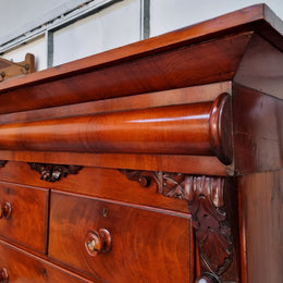 A 19th Century Scottish Flame Mahogany tall boy/ Chest of six drawers. Beautiful carvings and easily comes apart into three sections making transport o0r moving into place easy. In good original detailed condition.