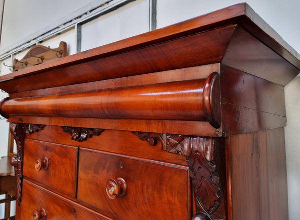 A 19th Century Scottish Flame Mahogany tall boy/ Chest of six drawers. Beautiful carvings and easily comes apart into three sections making transport o0r moving into place easy. In good original detailed condition.