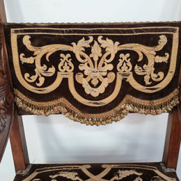 Beautifully carved Walnut Egyptian Revival armchair with amazing hand sewn Stumpwork embroidery coverings. In good original detailed condition.
