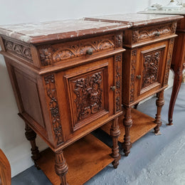 Late 19th Century pair of beautifully carved gothic style French oak bedside cabinets. It has lovely coloured marble tops with a drawer and cupboard for storage. In good original detailed condition.