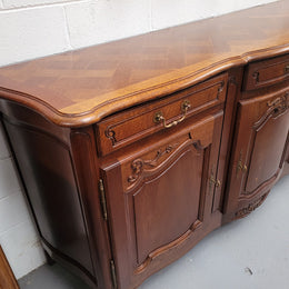 French Oak Louis XV style three drawer three door parquetry top sideboard. It has been sourced from France and is in good original detailed condition.