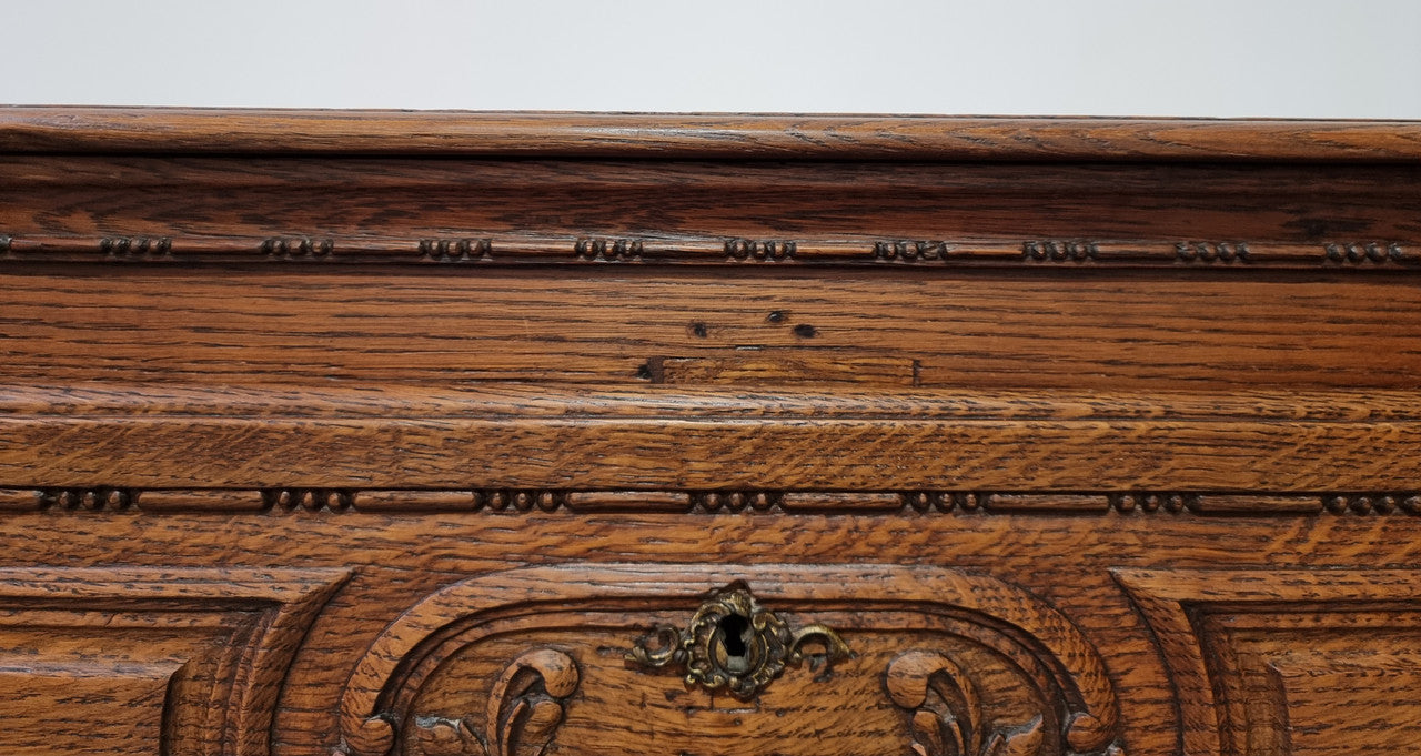 Early 19th Century French Oak chest of three drawers. It has beautiful handles and carvings. It is in good original detailed condition.