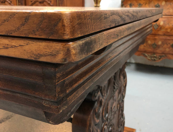 A beautiful French oak, Spanish style parquetry top extension table, with amazing carving and lovely details in very good condition.