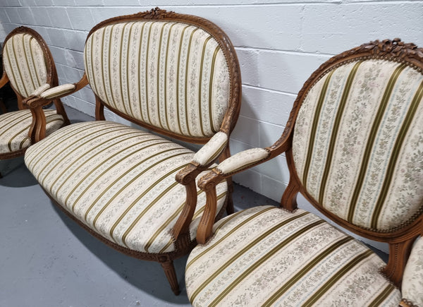 French carved Walnut Louis XV style settee and two matching armchairs. They are in good condition with upholstery also in good condition.