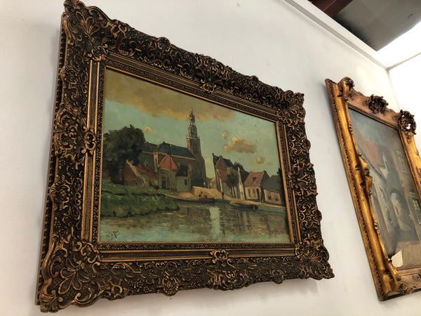 Sourced in France is this lovely oil on canvas town and river scene in a beautiful ornate frame. In good condition.