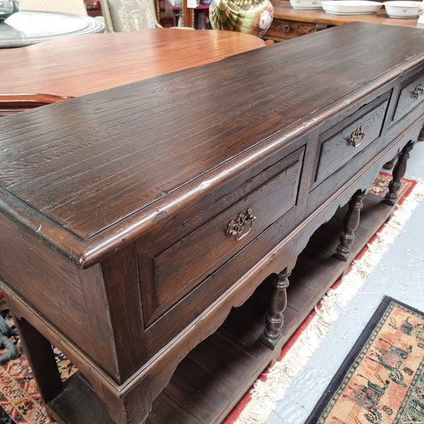 A very hard to find Vintage English kitchen dresser base of narrow proportions, sourced from France. In good original detailed condition.