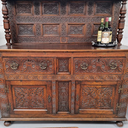 Impressively carved 18th Century English Oak kitchen dresser in 17th Century Jacobean style. It is in good original detailed condition and has been sourced from France.