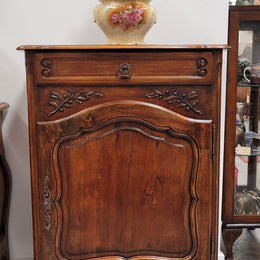 Louis 15th style walnut cupboard consisting of one drawer and two shelves. A pleasing unit with charming carvings. Circa: 1920's. In good original detailed condition.