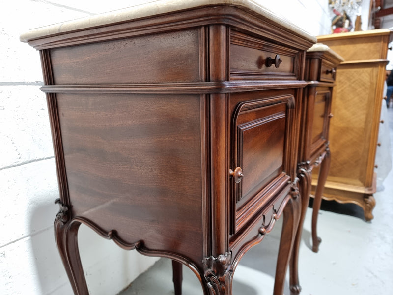Pair of elegant Louis XV style marble top walnut bedside cabinets. One drawer and one cupboard. Circa 1900 in good original detailed condition.