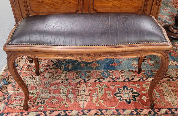 Impressive French Louis 15th style walnut upholstered duet leather stool. Very Good Condition.  Circa: 1930’s, sourced in France.