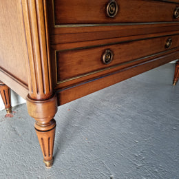 Beautiful French Louis XV Style Marble top five drawer commode. There are five drawers and it has a lovely brass inlay. It is in good original detailed condition.