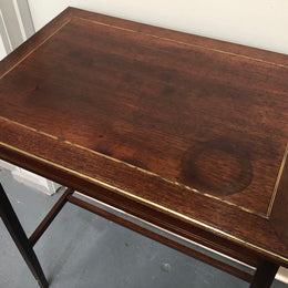 Elegant rectangular mahogany French brass inlaid occasional table. Is in good original condition.