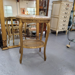 Stunning Louis XV style two tier marble topped gilt lamp/side table. It has been sourced from France and is in good original detailed condition.