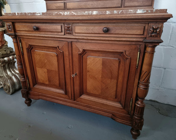 French 19th Century carved walnut Dressing table with a lovely marble top and decorative mirror. There are two cupboards and drawers for all your storage needs and in good original detailed condition.