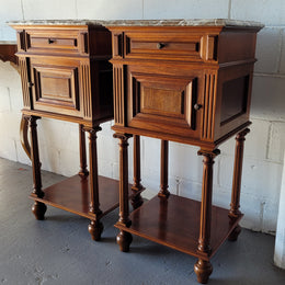 Pair of Henry II style Walnut bedside cabinets with a marble top. Circa 1920s and in good original condition.