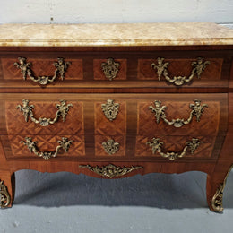 A beautifully inlaid parquetry three drawer commode with a lovely marble top, and decorative ormolu mounts. In good original detailed condition. Circa 1930