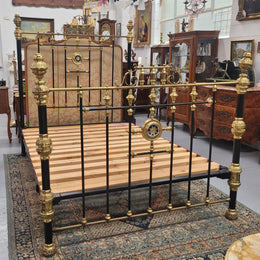 Rare Antique cast iron and brass Victorian queen size bed. Comes with custom made slats.  It has been sourced locally and is in good original condition.