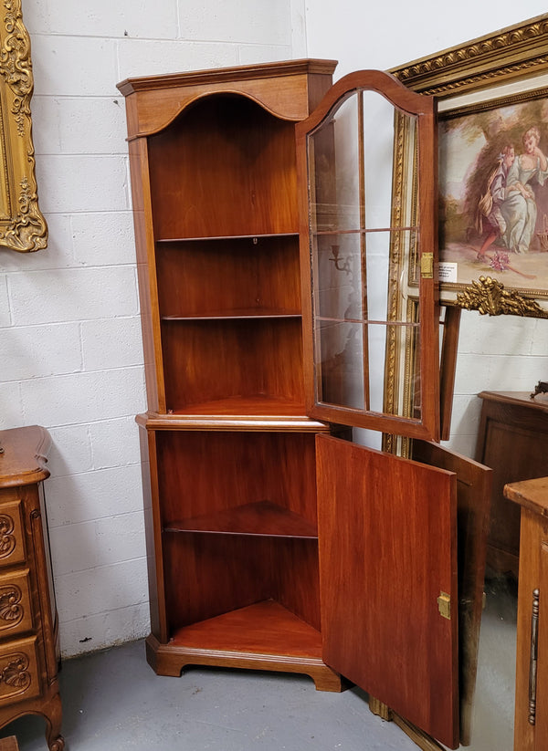 Practical Walnut corner cabinet with display and storage. Two shelf glass display on top and single shelf cupboard below. Sourced locally and in good original detailed condition.